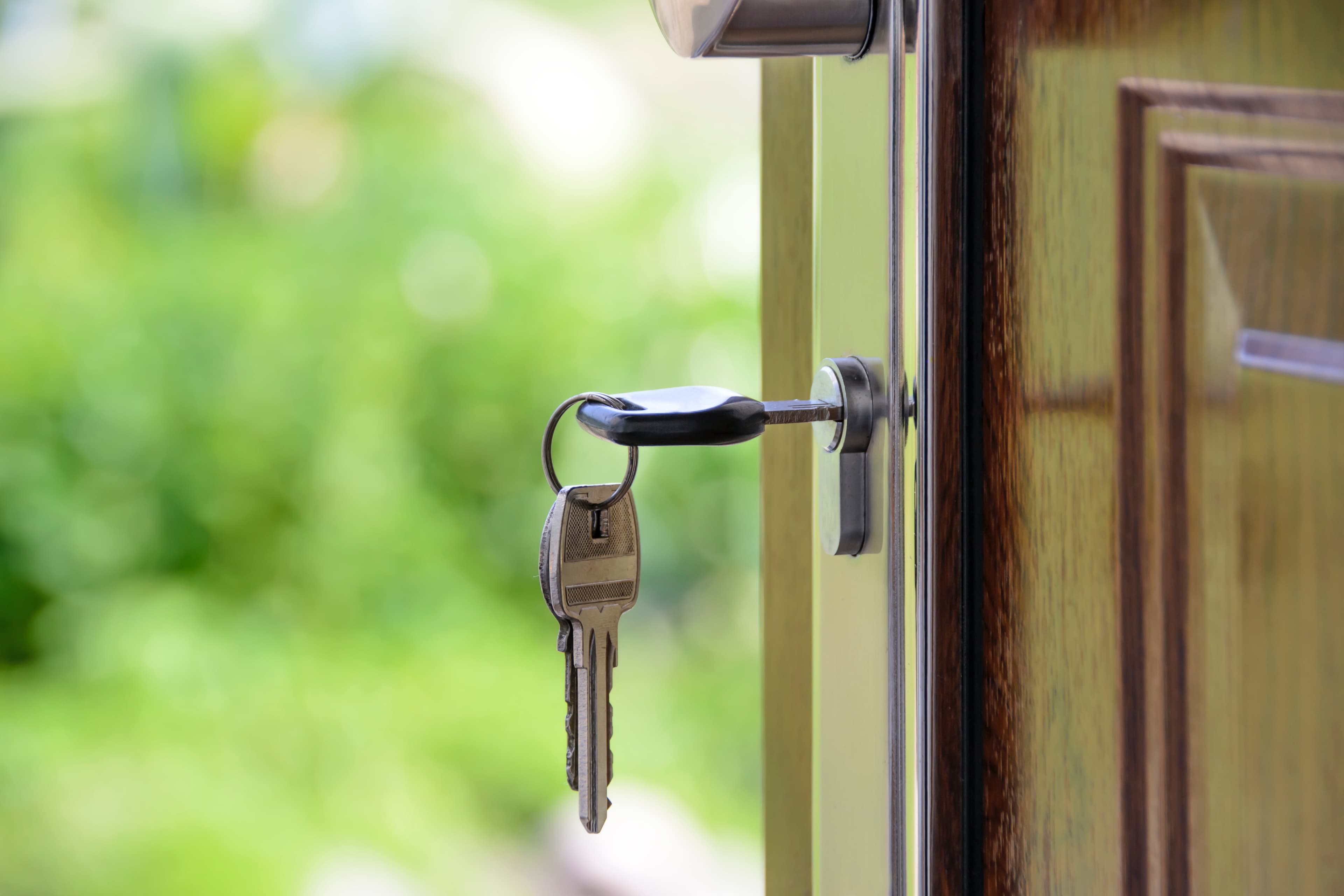 Cash For Keys: What It Is & What Landlords Should Know Key In Door
